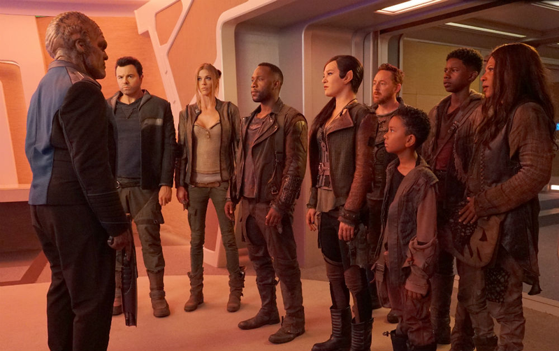 The Orville crew returns to their ship, several miles below the Pacific Ocean.